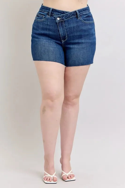 Plus size Judy Blue high waist denim shorts with criss-cross waistband, casual fit, and distressed detailing.