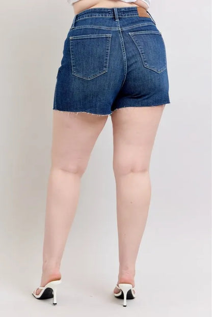 Plus size Judy Blue high waist denim shorts with criss-cross waistband and cuffed hem, featuring a stylish and comfortable fit.