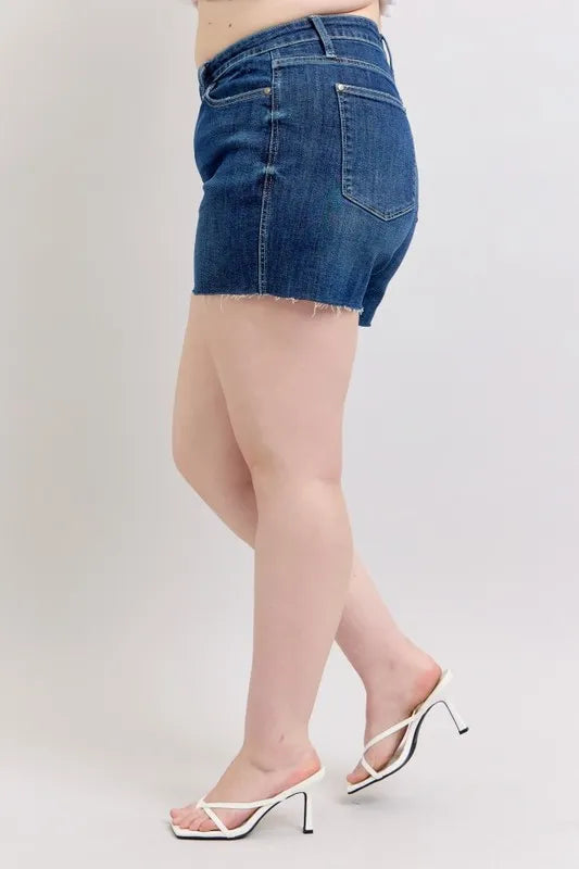Plus size Judy Blue high waist denim shorts with criss-cross waistband, showcasing the stylish design and fit.