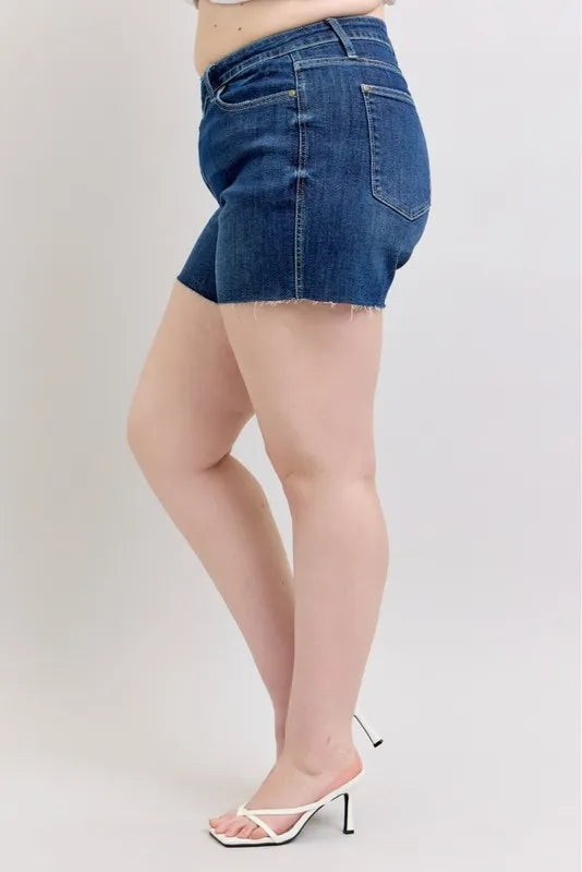 Plus size Judy Blue high waist denim shorts with criss-cross waistband, featuring full-length cut and stylish design.