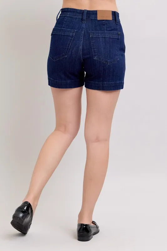 Plus size Judy Blue high waist denim shorts with a flattering fit and classic blue wash, styled for a casual summer look.