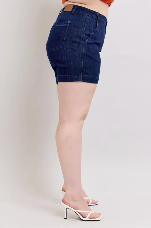 Plus size Judy Blue high waist denim shorts featuring a classic fit and distressed details, designed for a comfortable, stylish look.