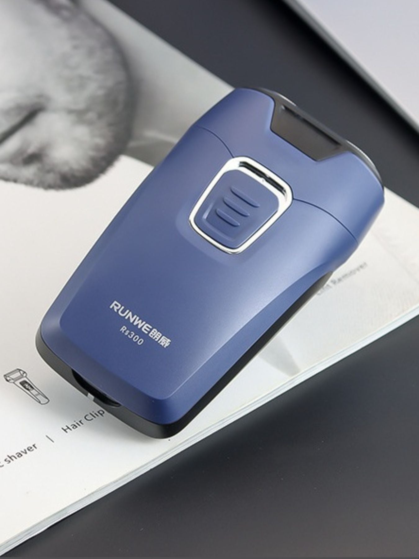 Dusty blue portable electric shaver by Trendsi with compact design and rechargeable battery, ideal for travel grooming.
