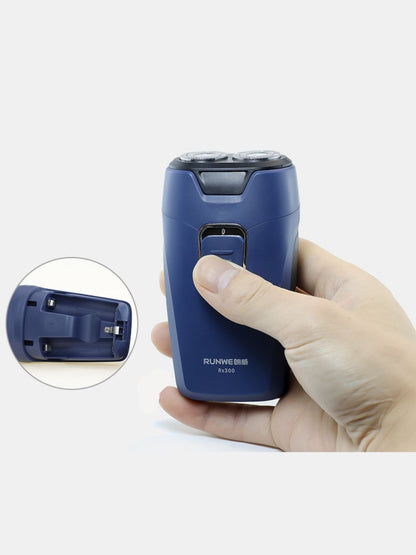 Dusty blue portable electric shaver by Trendsi, compact design with ergonomic grip and rotary blades for a close shave.