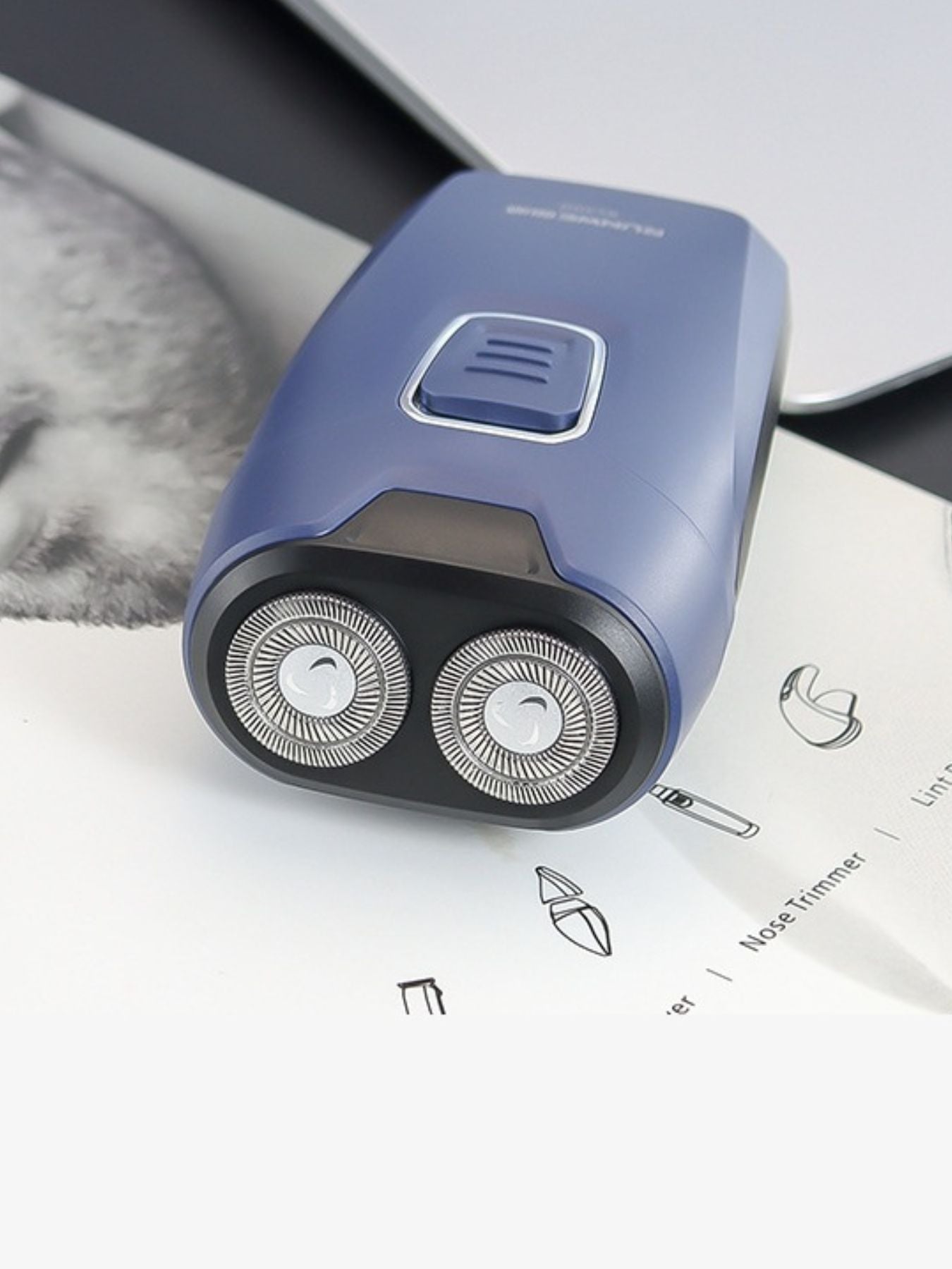 Dusty blue portable electric shaver by Trendsi, compact design with dual blades for easy grooming on the go.