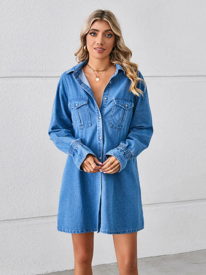 Dusty blue pocketed dropped shoulder mini denim dress by Trendsi, featuring a casual, relaxed fit with front patch pockets.