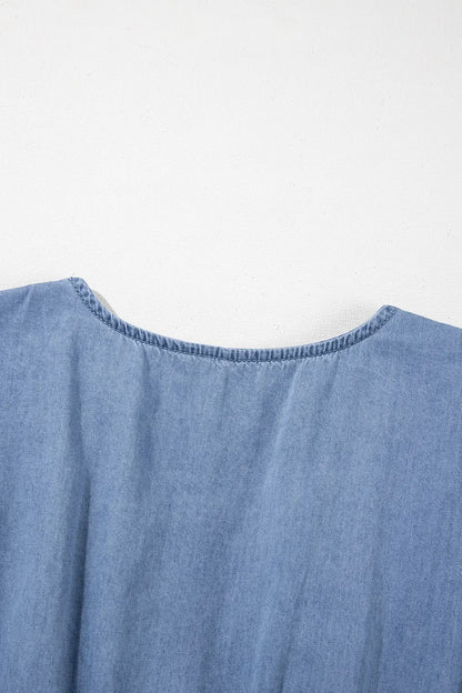Dusty blue denim mini dress with ruffled hem, smocked bodice, and flutter sleeves from Trendsi.