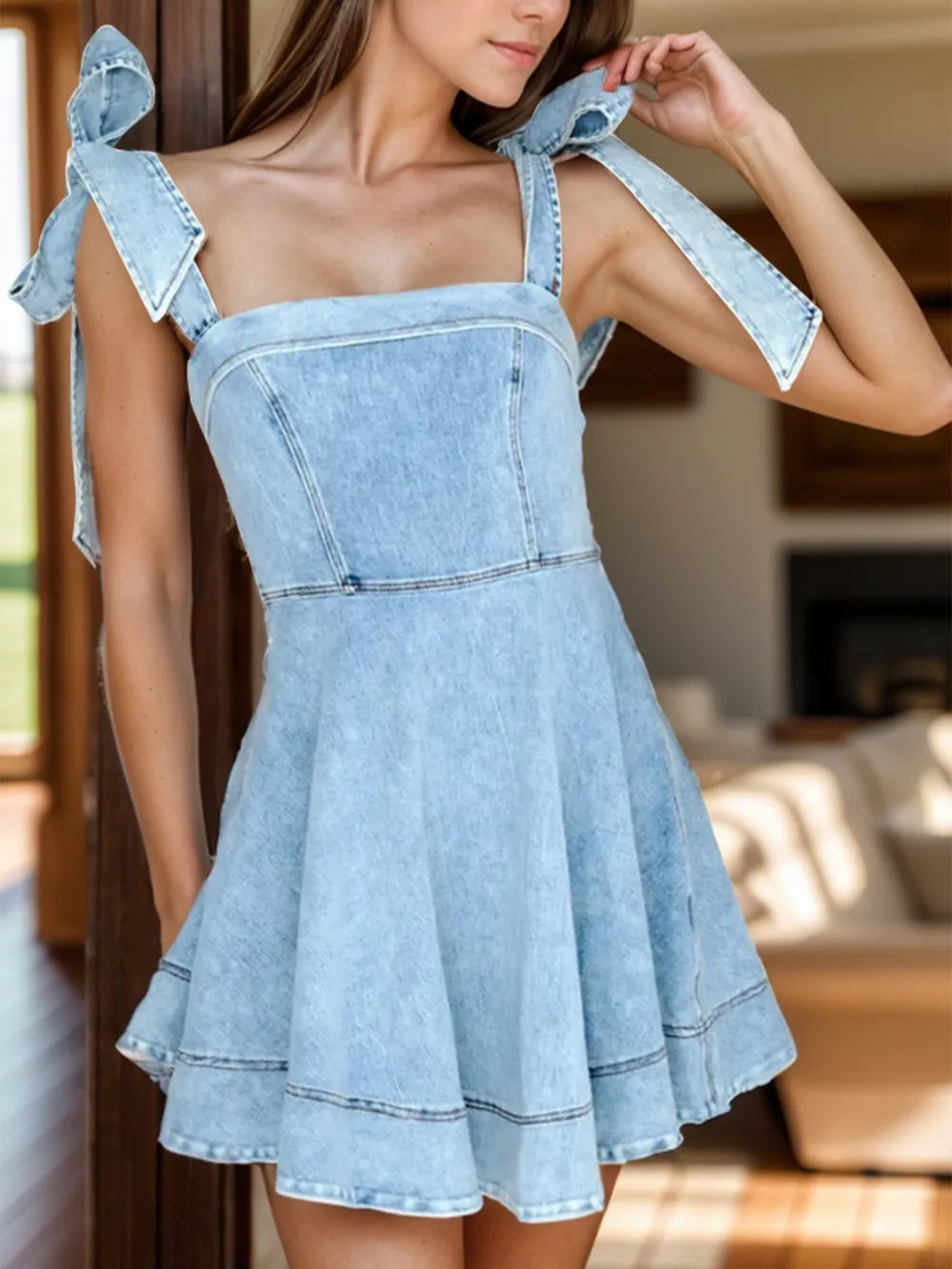 Dusty blue denim dress with square neckline and tie shoulder straps, by Trendsi, displayed on a hanger.