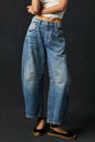 Dusty blue wide-leg jeans by Trendsi featuring large front pockets, relaxed fit, and casual denim style.