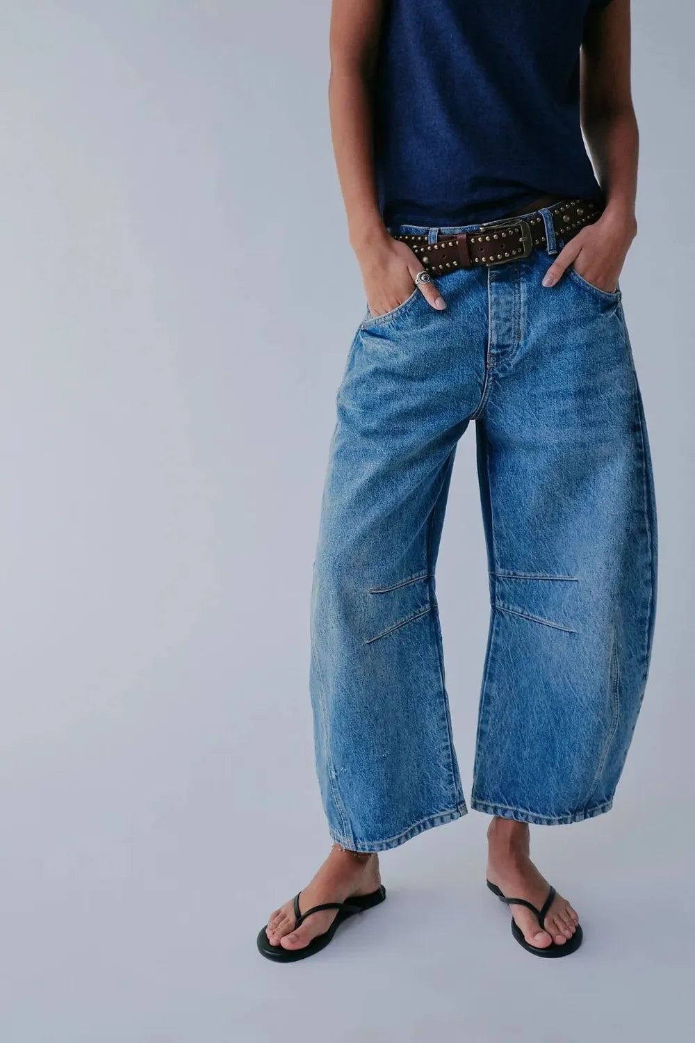 Dusty blue wide leg jeans with pockets from Trendsi, showing a relaxed fit and stylish denim design.