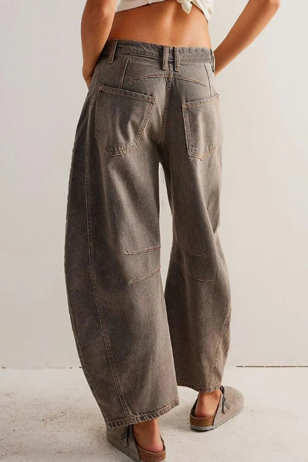 Dusty blue wide leg jeans with pockets from Trendsi, featuring a relaxed fit and classic denim style.