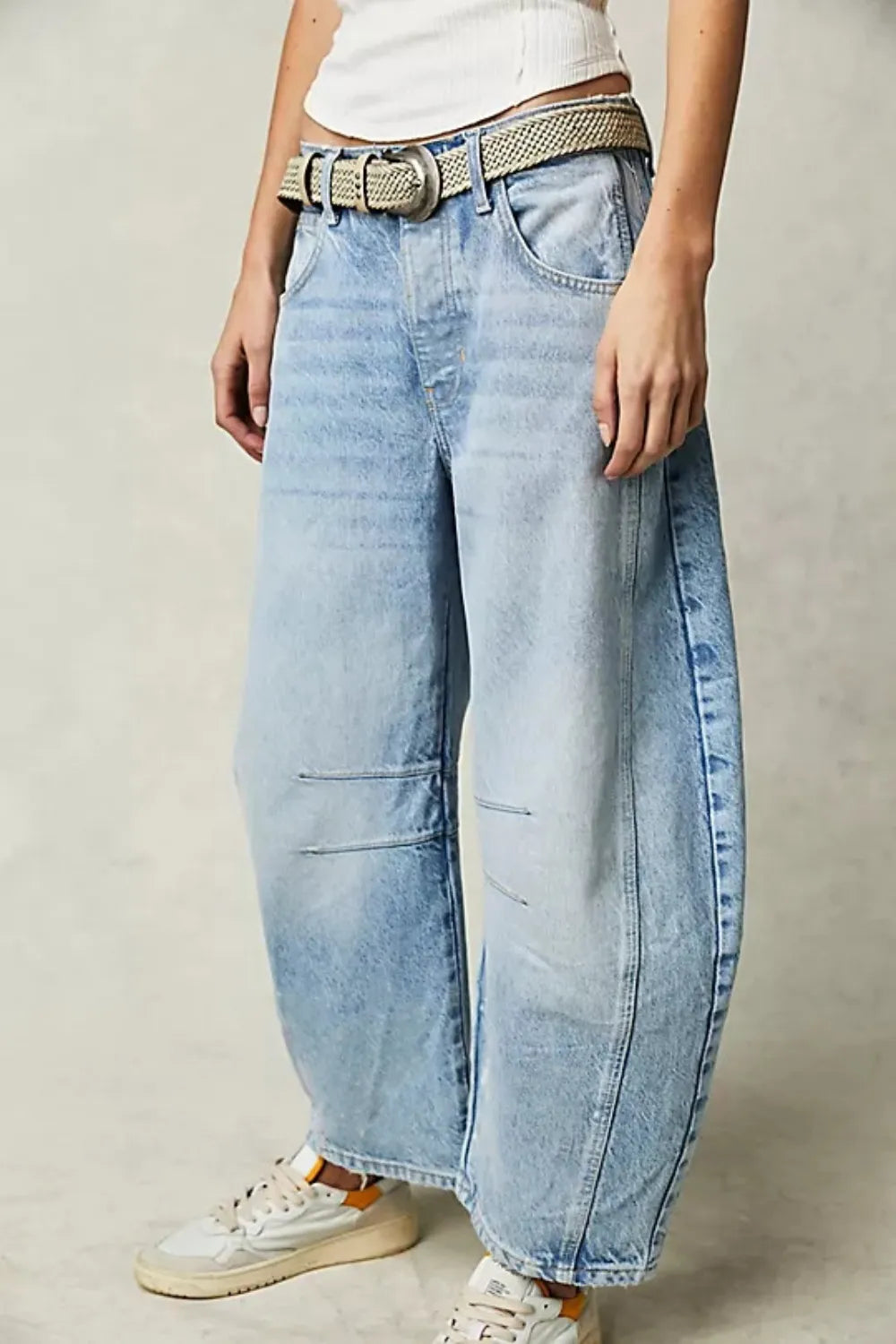 Dusty blue wide leg jeans with front and back pockets from Trendsi, styled for a relaxed, casual look.