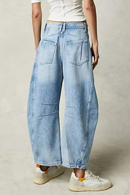 Dusty blue wide leg jeans with pockets from Trendsi, featuring a relaxed fit and classic denim style.