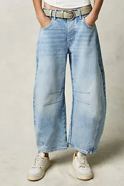 Dusty blue wide leg jeans with pockets from Trendsi, featuring a relaxed fit and classic denim style.