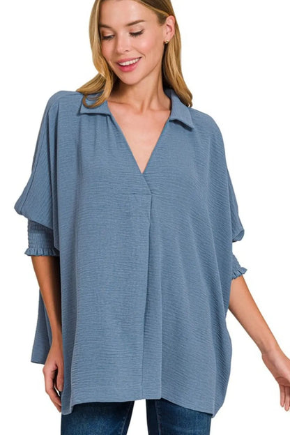 Dusty blue Zenana Airflow Collar Tee with smocked sleeve band, featuring a relaxed fit and breathable fabric.