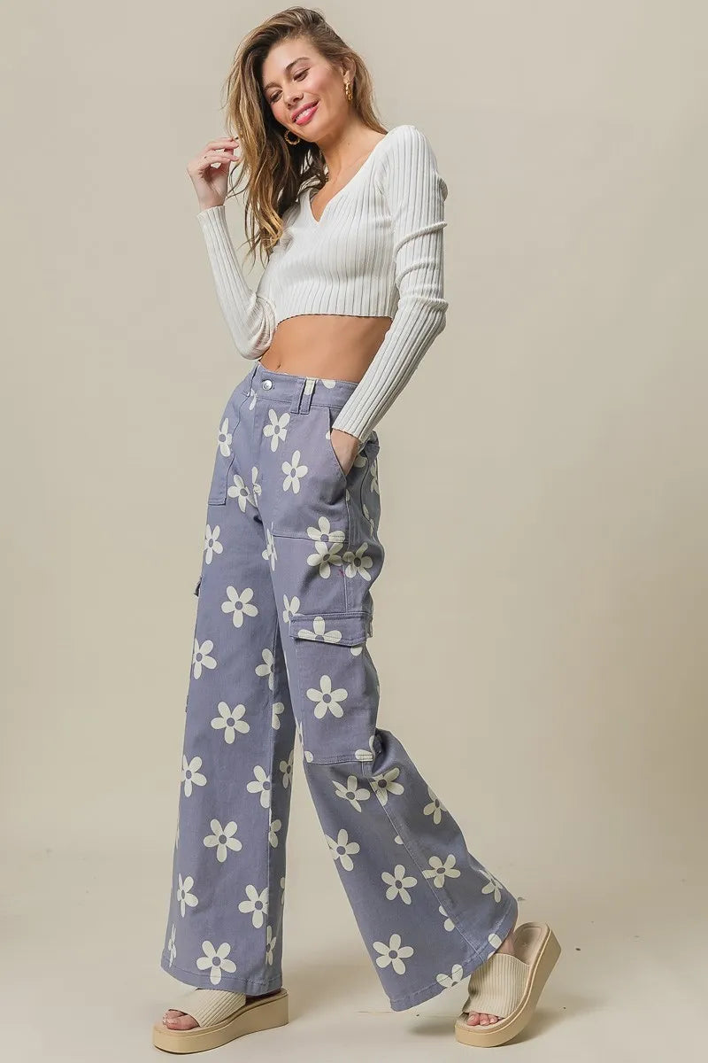 Dusty lavender wide pants with Bibi flower print and side pockets from Trendsi, featuring a relaxed, flowy fit.