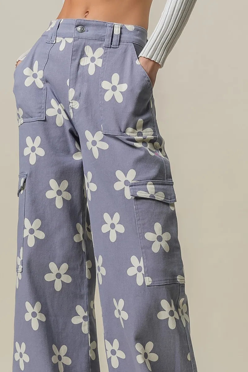 Dusty lavender wide pants with Bibi flower print and side pockets by Trendsi, featuring a relaxed, flowy fit.