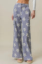 Dusty lavender BiBi Flower printed wide pants with side pockets from Trendsi, featuring a relaxed, flowy fit and floral design.