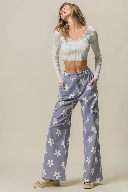 Dusty lavender BiBi Flower printed wide pants by Trendsi with side pockets, featuring a comfortable, flowy design and floral pattern.