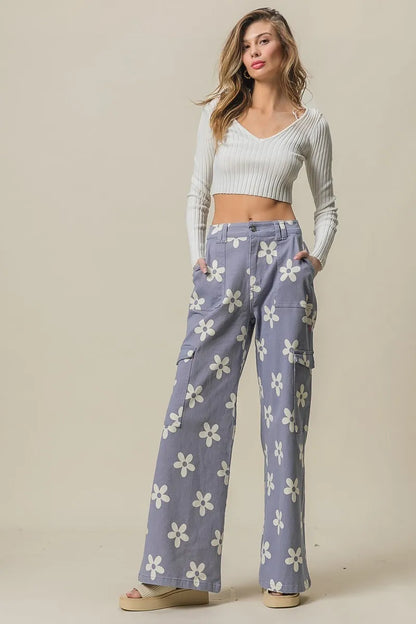 Dusty lavender BiBi Flower printed wide pants with side pockets from Trendsi, showcasing their stylish design and comfortable fit.