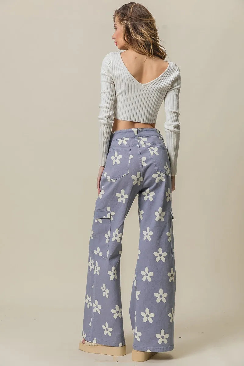 Dusty lavender BiBi Flower printed wide pants with side pockets by Trendsi, featuring a relaxed, flowy fit and floral pattern.