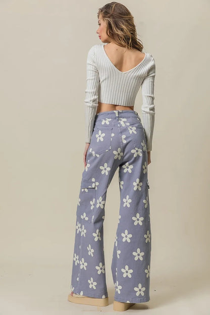 Dusty lavender BiBi Flower printed wide pants with side pockets by Trendsi, featuring a relaxed, flowy fit and floral pattern.