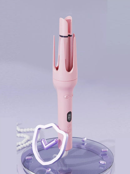 Dusty pink automatic rotating ceramic hair curling iron by Trendsi with European plug, showcasing its sleek design and rotating barrel.