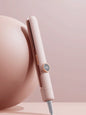 Dusty pink Trendsi fast heating hair straightener with North American plug, ceramic plates, and sleek design for smooth styling.