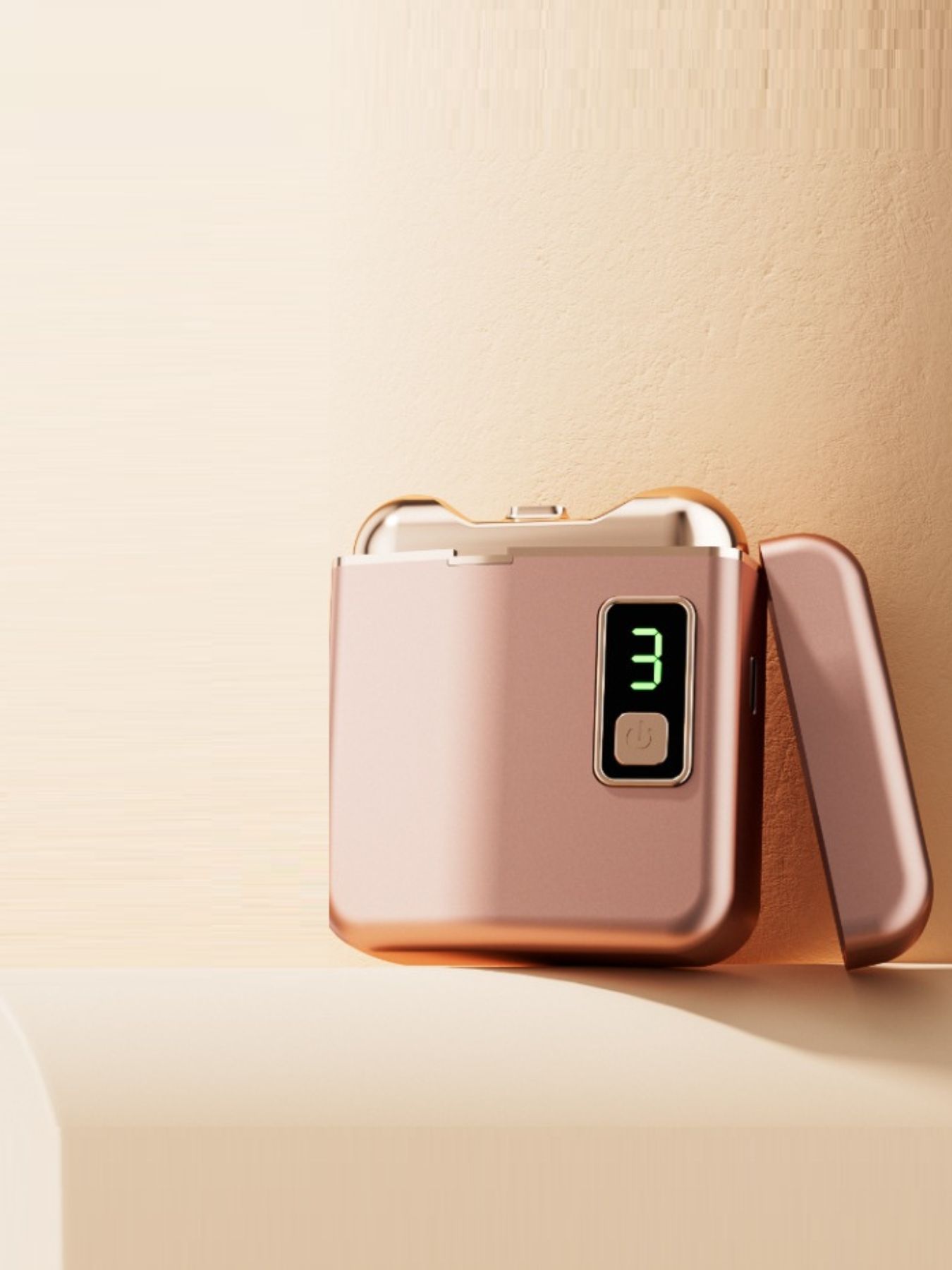 Dusty pink portable electric nail buffer by Trendsi, showing compact design and textured buffer surface for manicures.