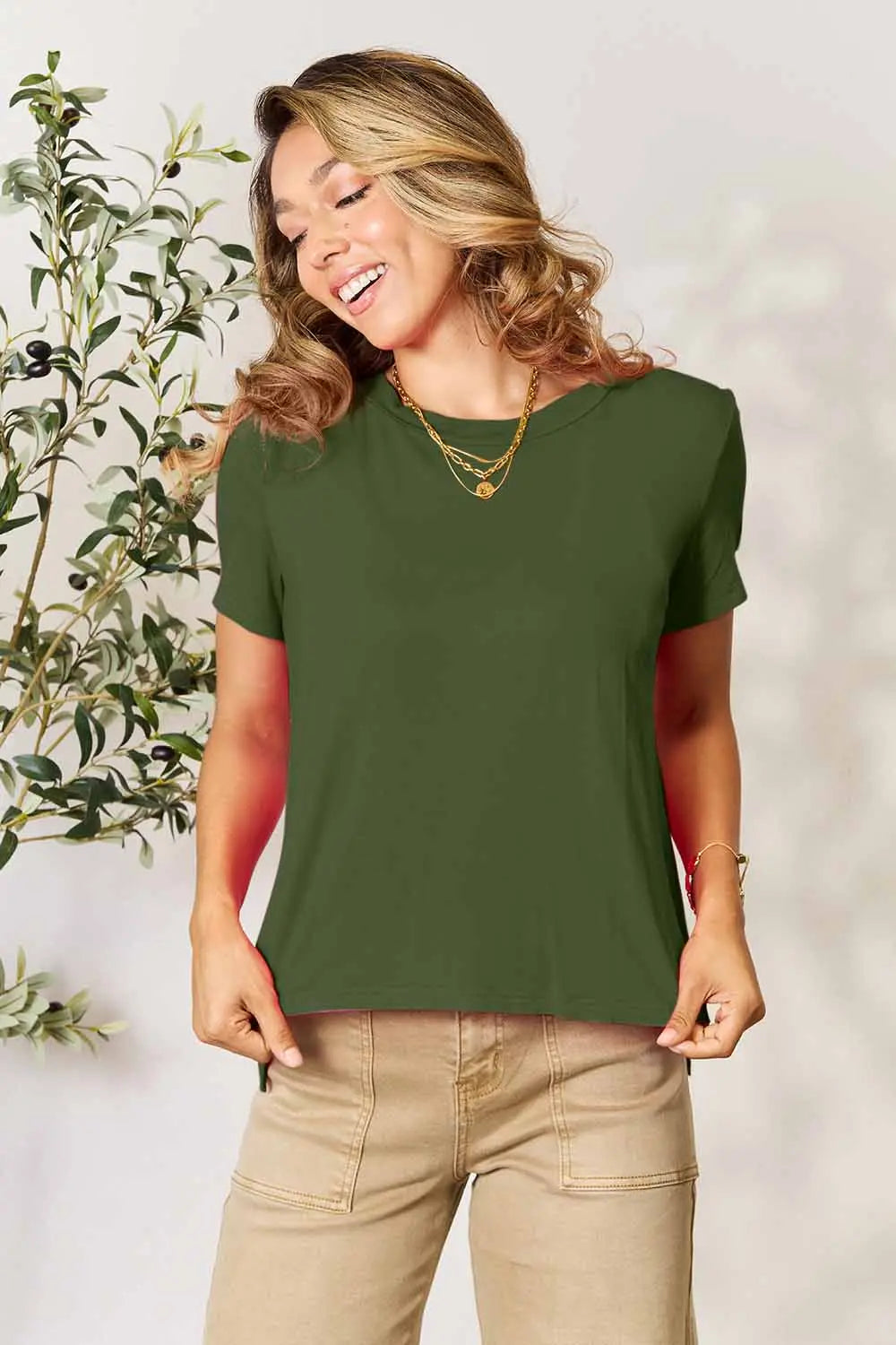 Dusty pink Basic Bae full-size round neck short sleeve T-shirt by Trendsi, shown on a hanger with a plain background.