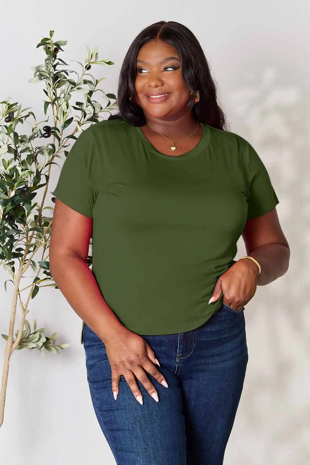 Dusty pink Basic Bae full-size round neck short sleeve T-shirt by Trendsi displayed on a hanger.