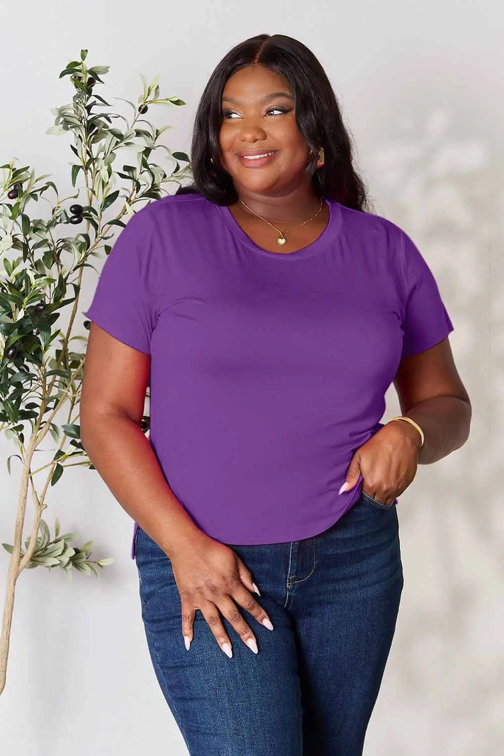 Dusty pink Basic Bae full-size round neck short sleeve T-shirt by Trendsi, displayed on a hanger with a plain background.