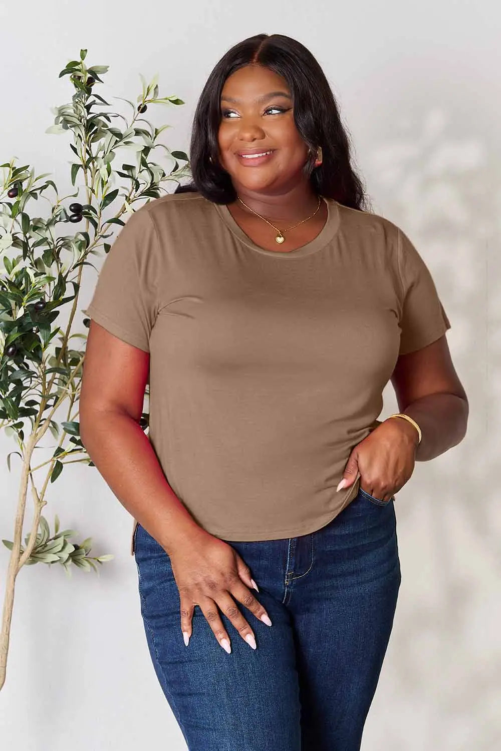 Dusty pink Basic Bae T-shirt by Trendsi, full-size round neck, short-sleeve casual top displayed on a hanger.