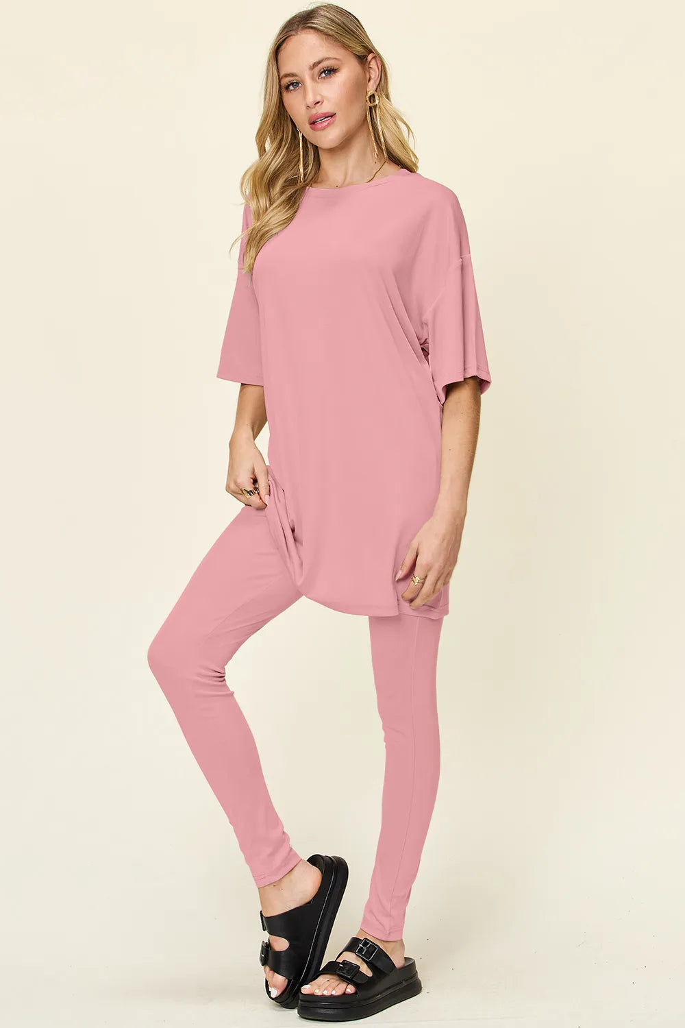 Dusty pink Trendsi double take full-size round neck T-shirt and leggings set with dropped shoulders, casual and comfortable.