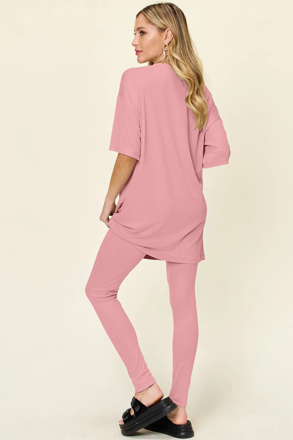 Dusty pink double take full-size T-shirt and leggings set by Trendsi, featuring a round neck and dropped shoulder design.