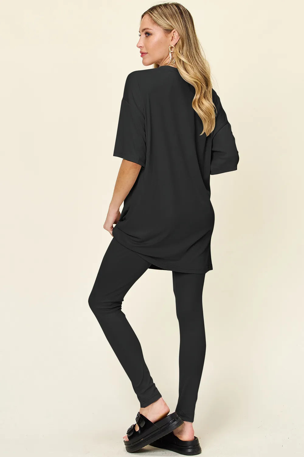 Dusty pink Trendsi double take full-size round neck t-shirt and leggings set with dropped shoulders, casual and comfortable look.
