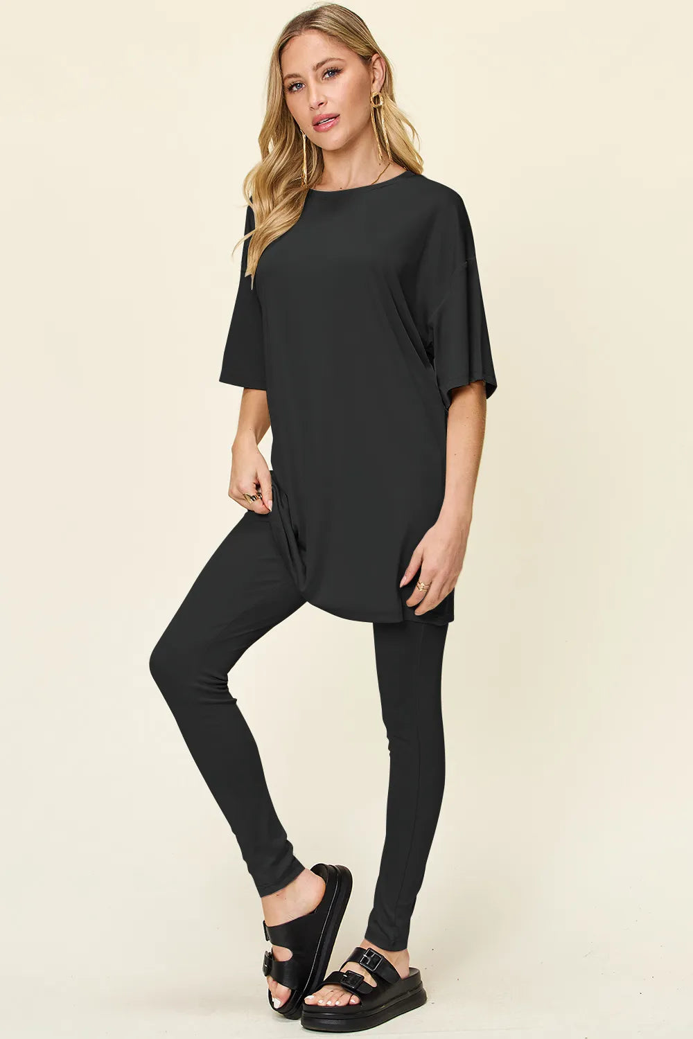 Dusty pink Trendsi double take full-size t-shirt and leggings set with round neck and dropped shoulders, casual activewear ensemble.
