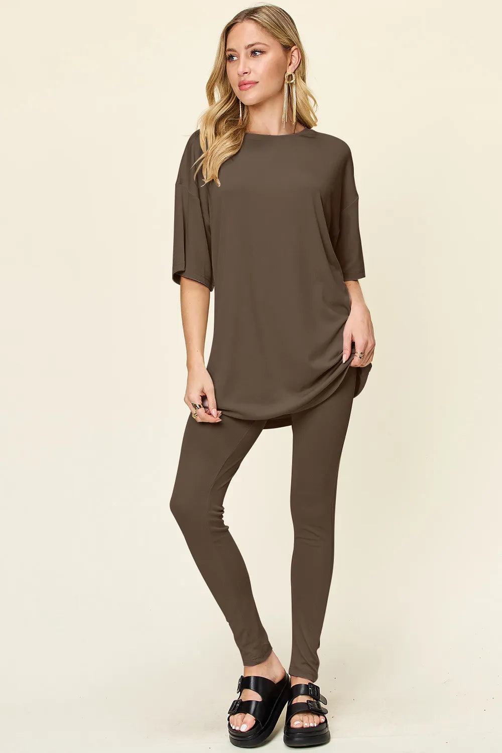 Dusty pink Trendsi Double Take full-size T-shirt and leggings set with round neck and dropped shoulder style, casual and comfortable.