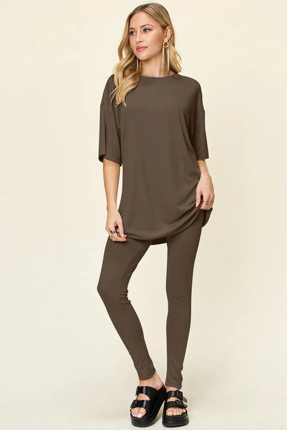 Dusty pink Trendsi Double Take full-size T-shirt and leggings set with round neck and dropped shoulder style, casual and comfortable.