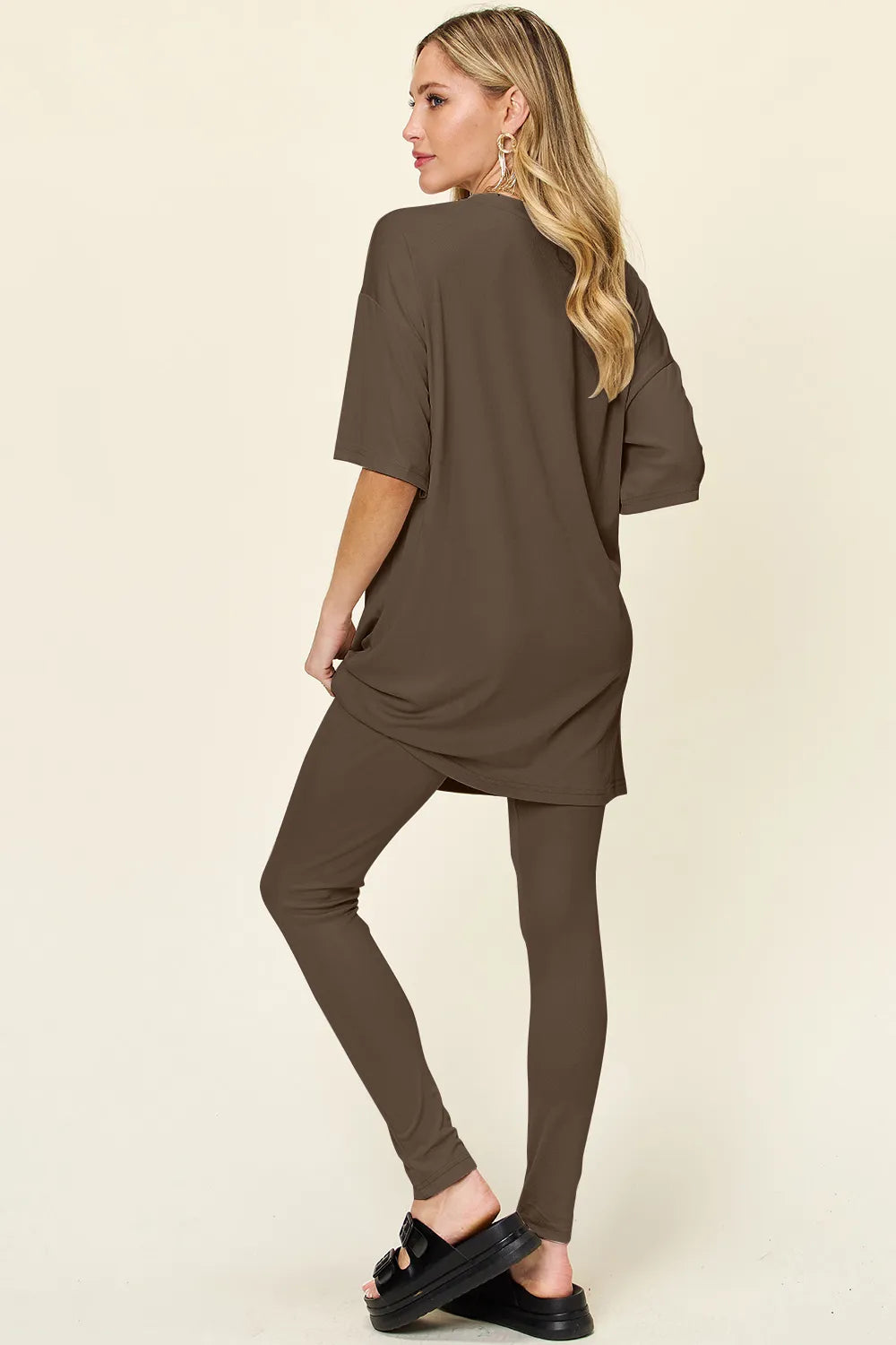 Dusty pink double take full-size T-shirt and leggings set by Trendsi featuring round neck and dropped shoulder design.
