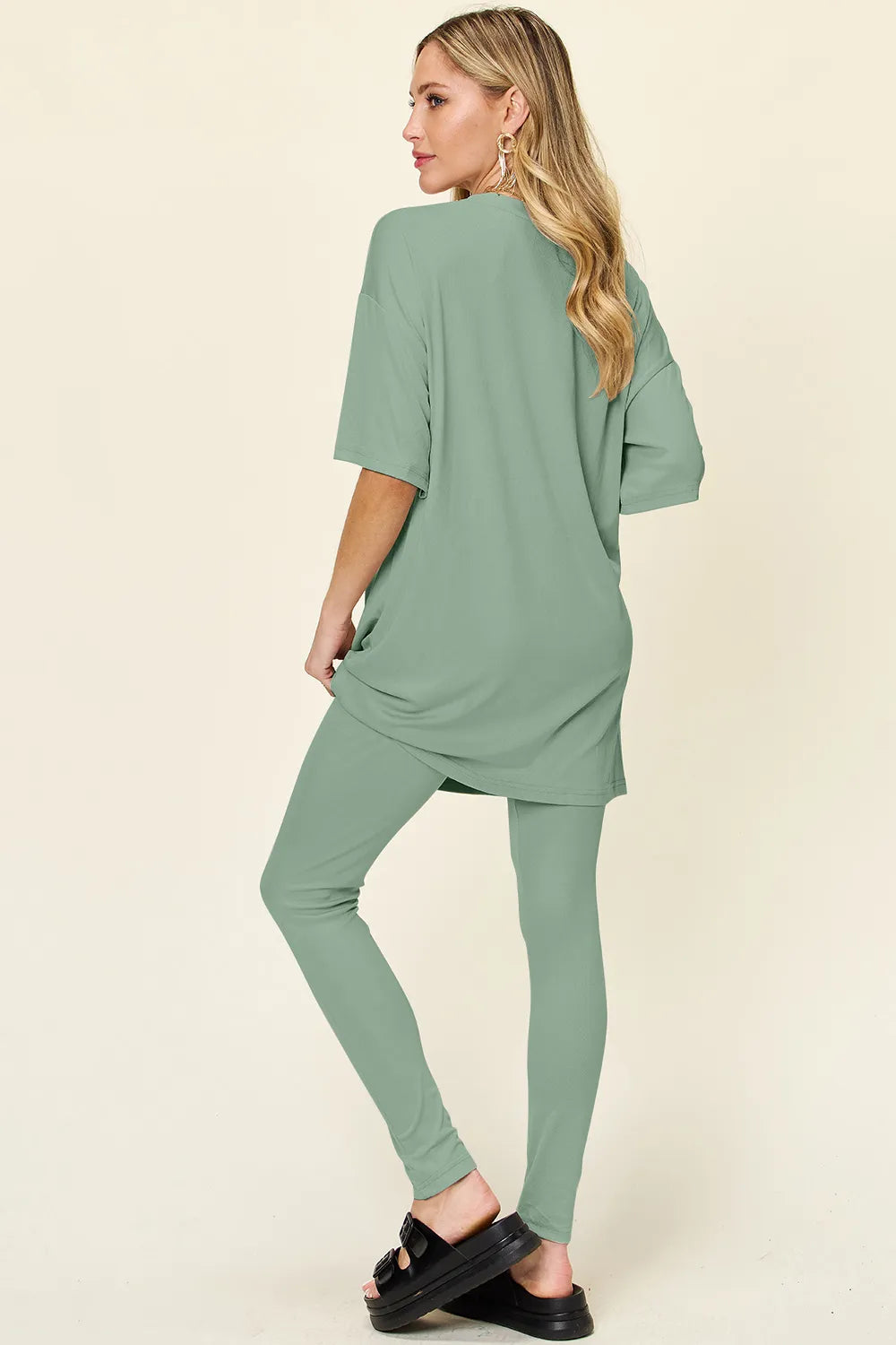 Dusty pink Trendsi Double Take full-size T-shirt and leggings set with round neck and dropped shoulder style, casual and comfortable.