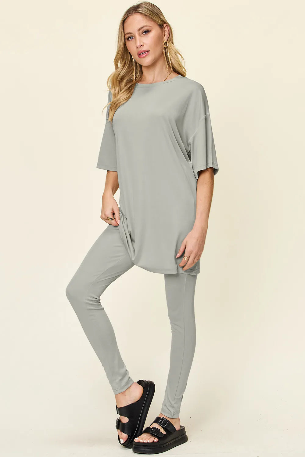 Dusty pink double take full-size T-shirt and leggings set with round neck and dropped shoulders by Trendsi.
