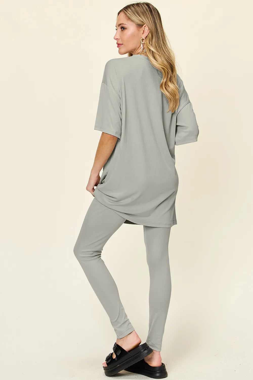 Dusty pink double take full-size T-shirt and leggings set with round neck and dropped shoulders by Trendsi.