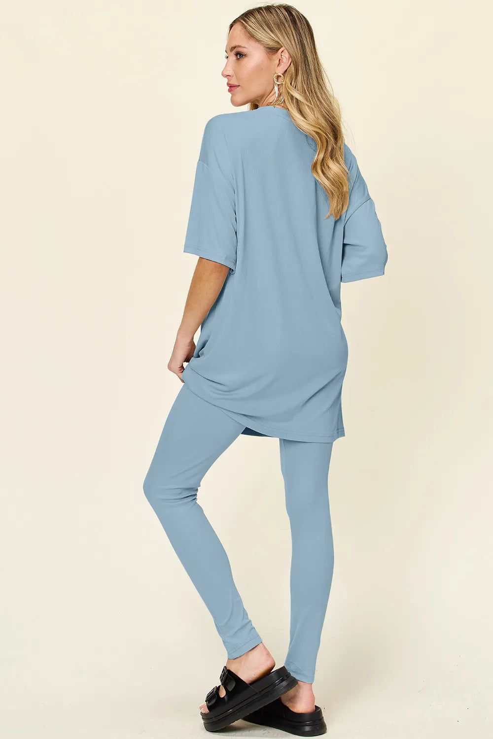 Dusty pink Trendsi double take full-size T-shirt and leggings set with round neck and dropped shoulders, casual and comfortable.