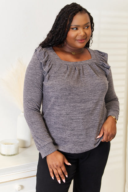 Dusty pink long sleeve T-shirt with square neckline and ruffle shoulder details from Trendsi, featuring a stylish, casual design.