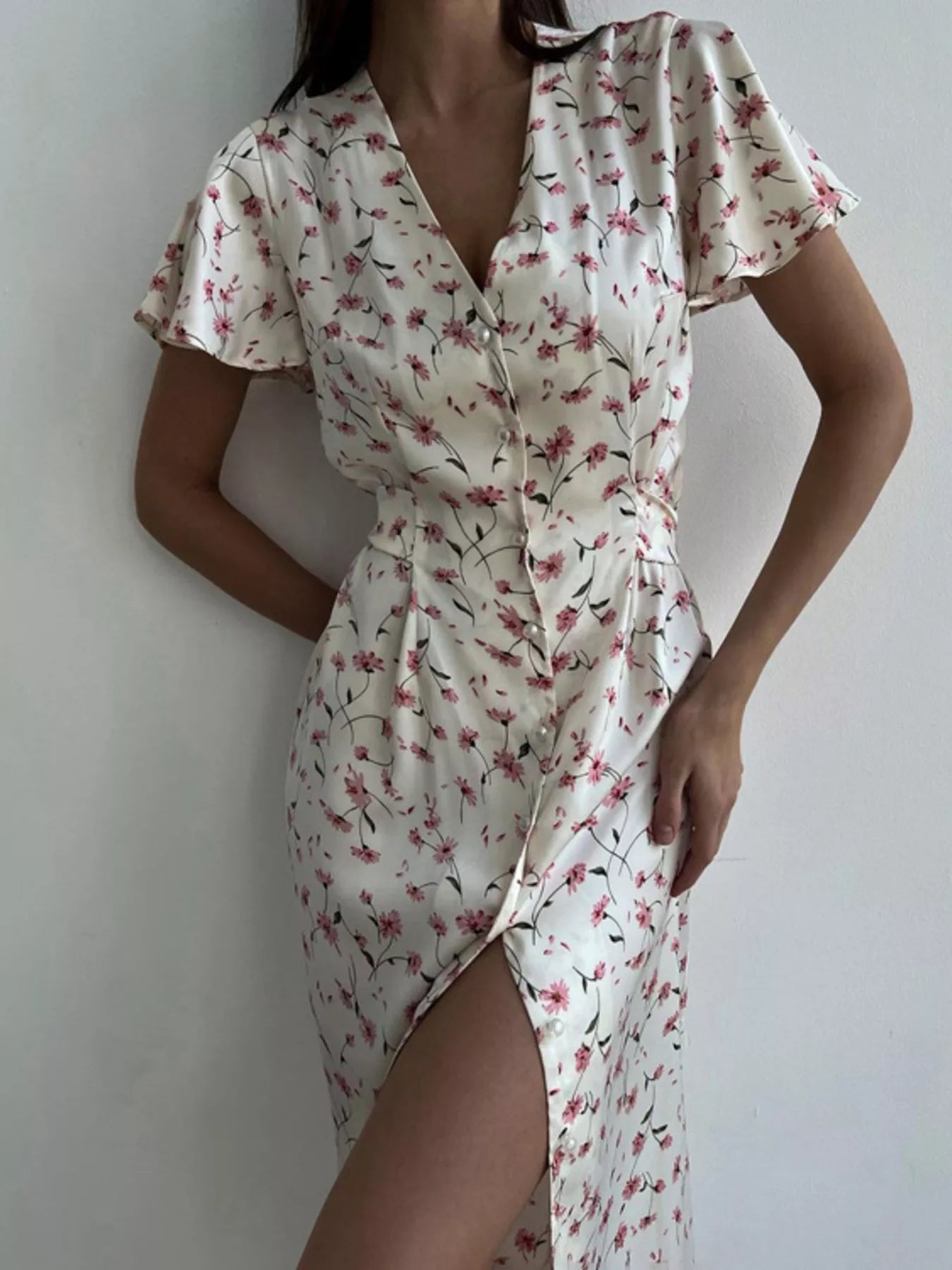 Dusty pink floral print V-neck midi dress with flutter sleeves from Trendsi, showcasing a flowing, feminine silhouette.