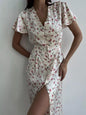Dusty pink floral print V-neck midi dress with flutter sleeves from Trendsi, showcasing a flowing, feminine silhouette.