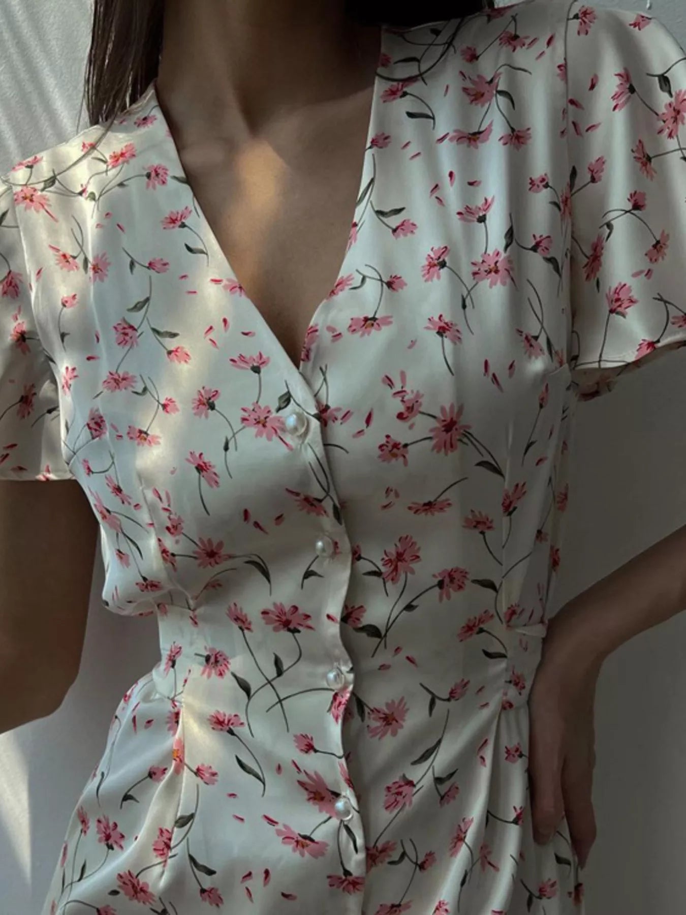 Dusty pink floral print V-neck midi dress with flutter sleeves from Trendsi, showcasing a stylish and feminine look.