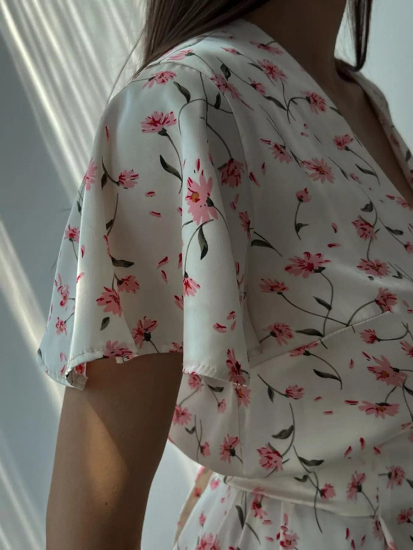 Dusty pink floral print V-neck midi dress with flutter sleeves from Trendsi, showcasing a stylish and feminine design.