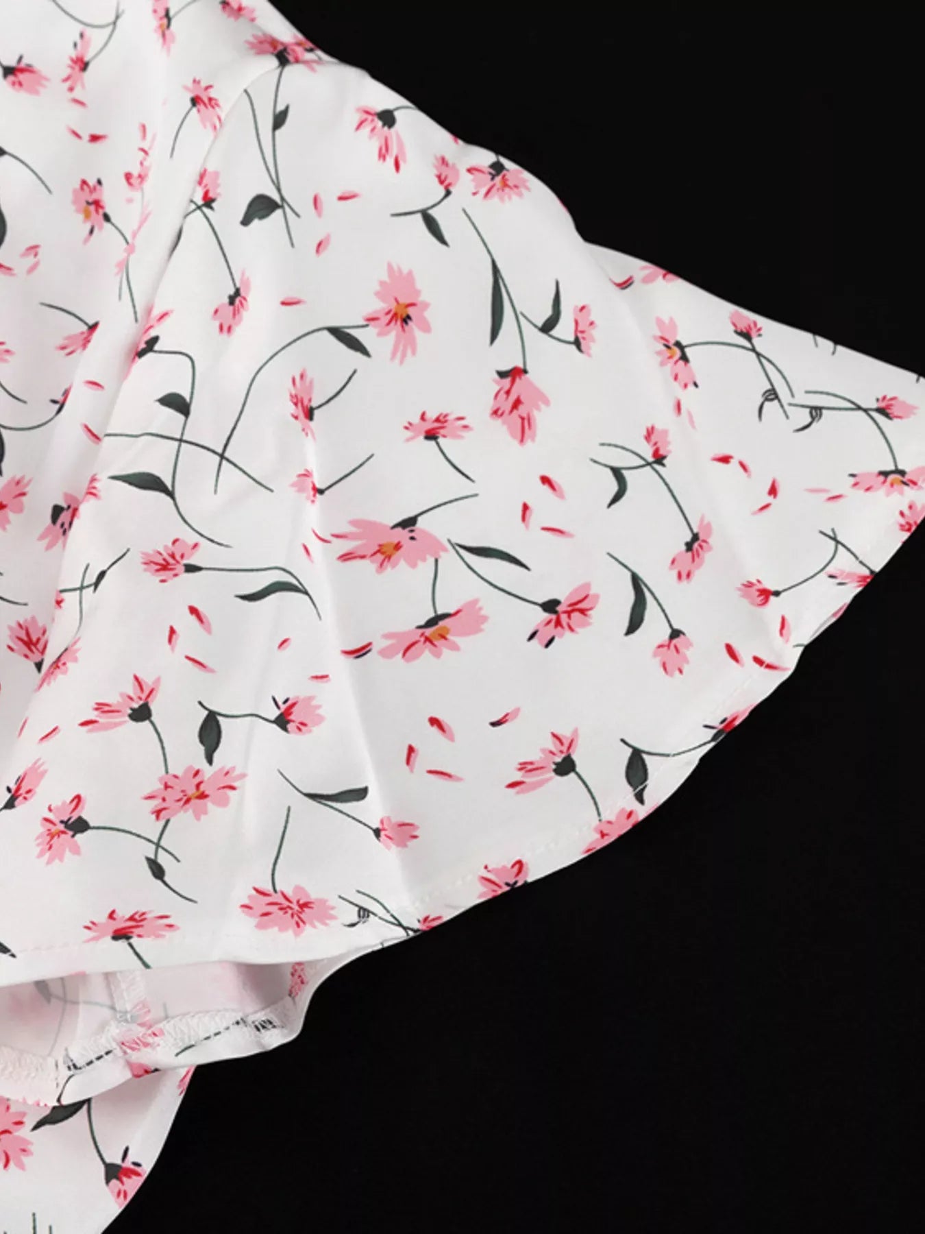 Dusty pink floral print V-neck midi dress with flutter sleeves by Trendsi, showcasing a flowy, feminine design.